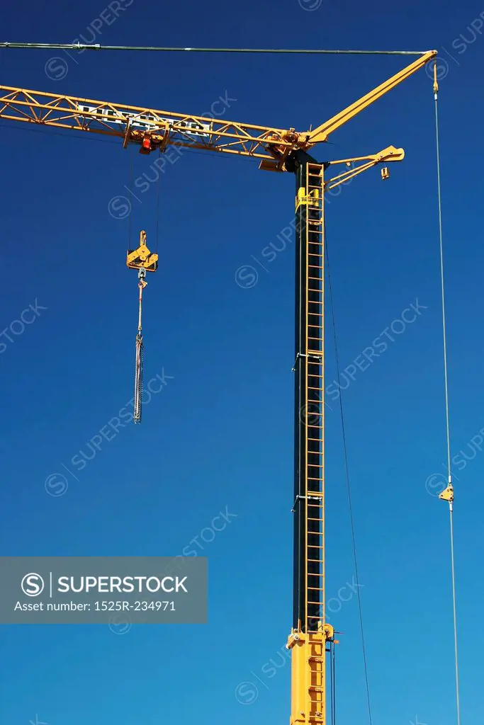 Tall Crane at Construction Site