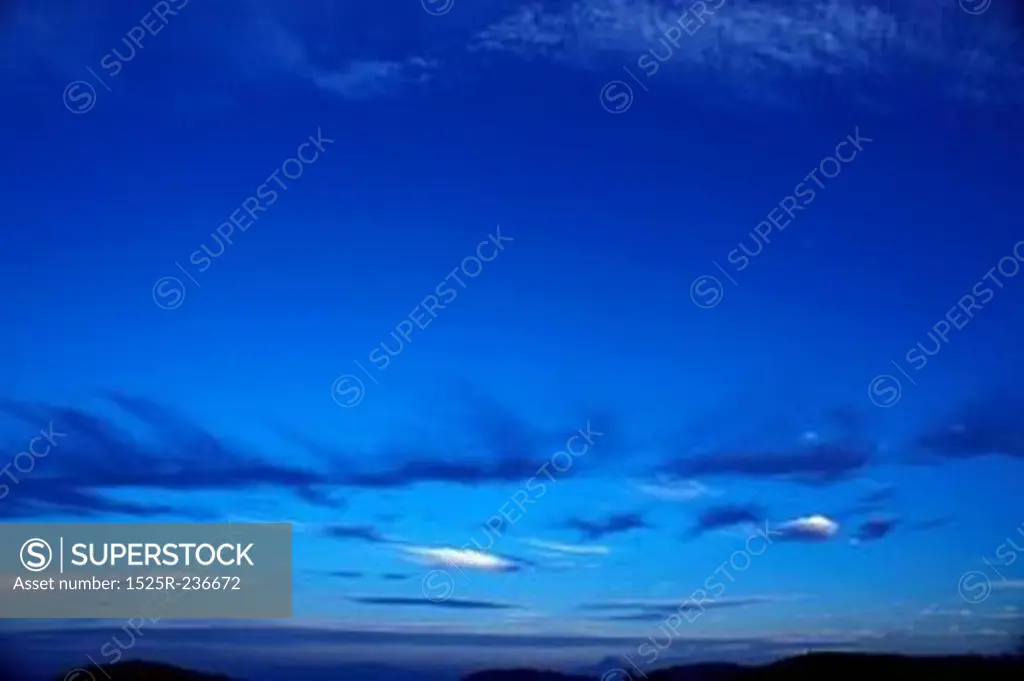 Small Light And Dark Clouds In A Deep Blue Sky