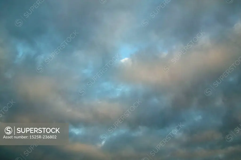 Dark Clouds Filling A Light Blue Sky