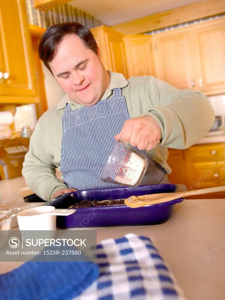 Man With Down Syndrome Making A Cake