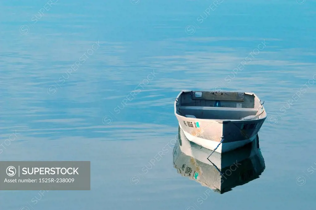 Empty Boat Floating In Tranquil Waters