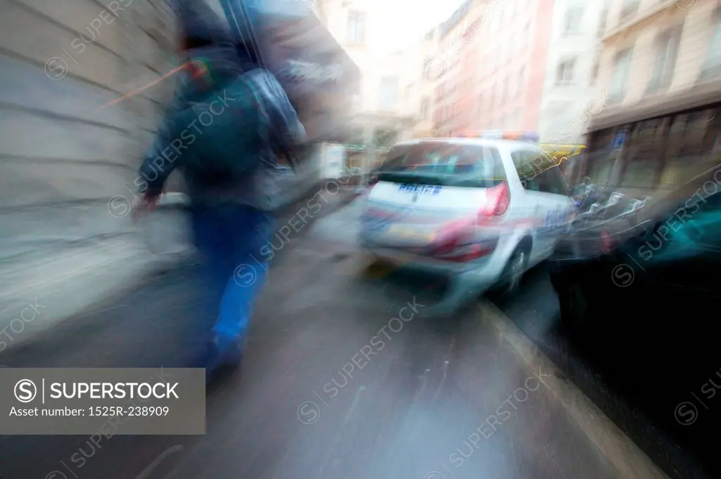 Pedestrian Approaching Police Car in Street