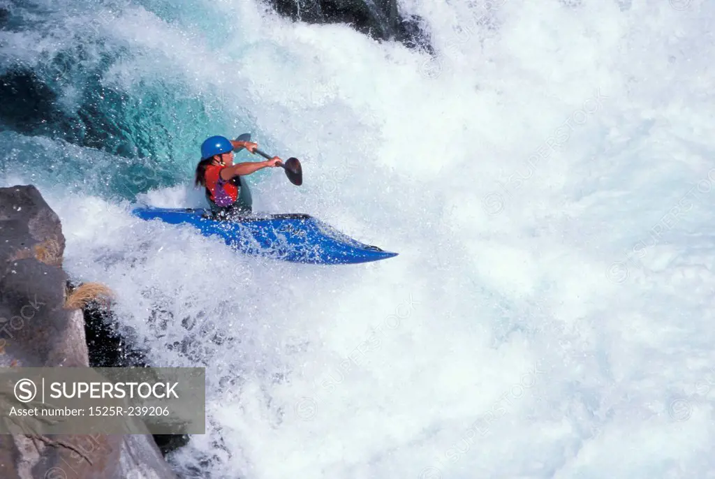 Kayaking Over A Waterfall