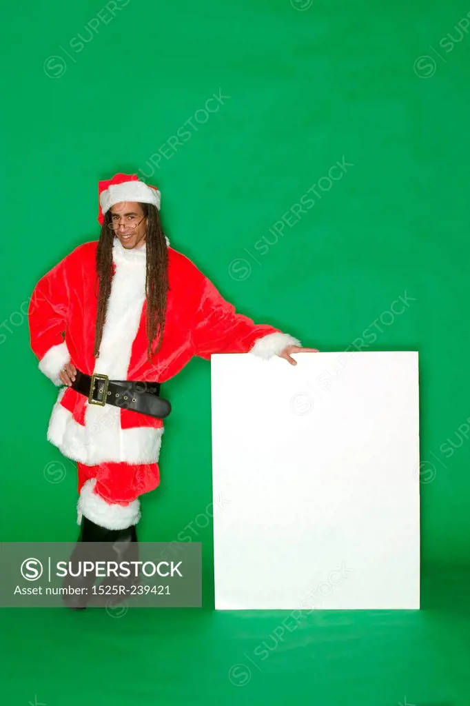 Young Black Santa Standing Next to Blank Sign