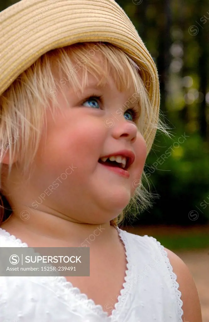 Smiling Child With Straw Hat