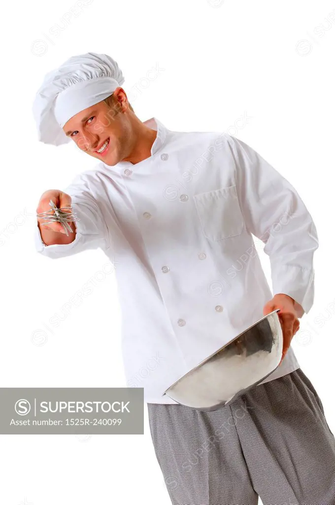 Chef in chefs whites and toque holding whisk and bowl mixing batter