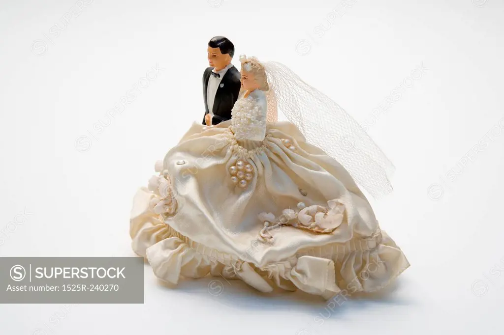 Figurines of bride and groom, wedding cake topper