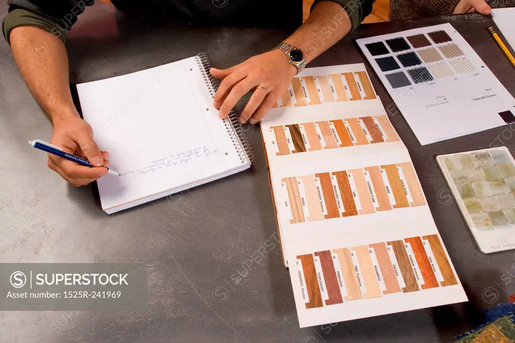 Man Taking Notes with Color Palettes