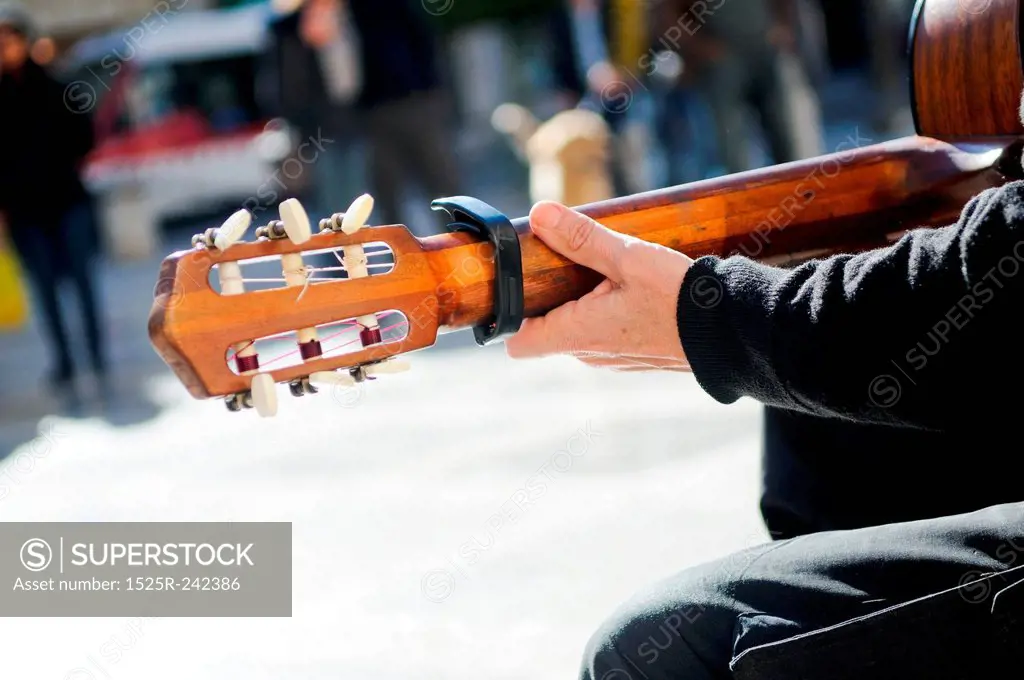 Busker playing guitar