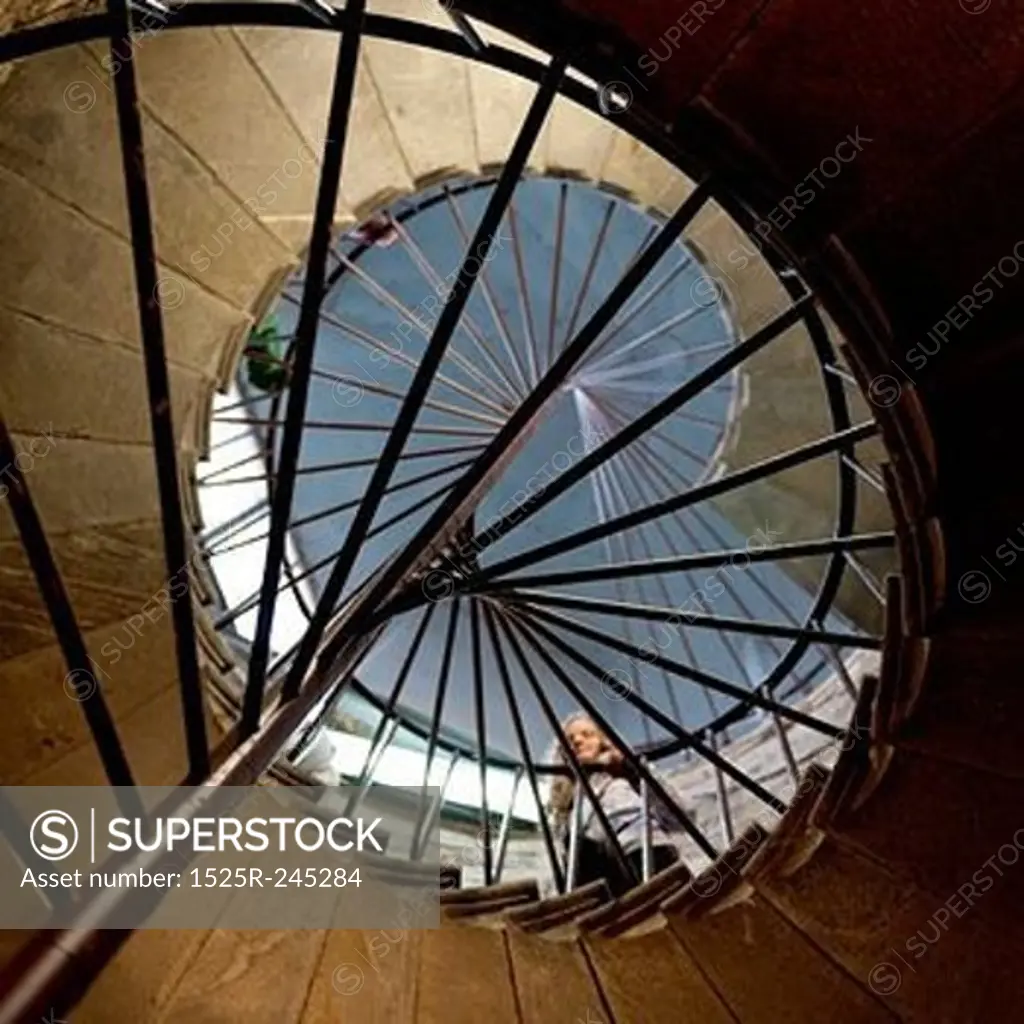 Low angle view of a woman standing on spiral staircase of the Saint Isaac's Cathedral, St. Isaac's Square, St. Petersburg, Russia