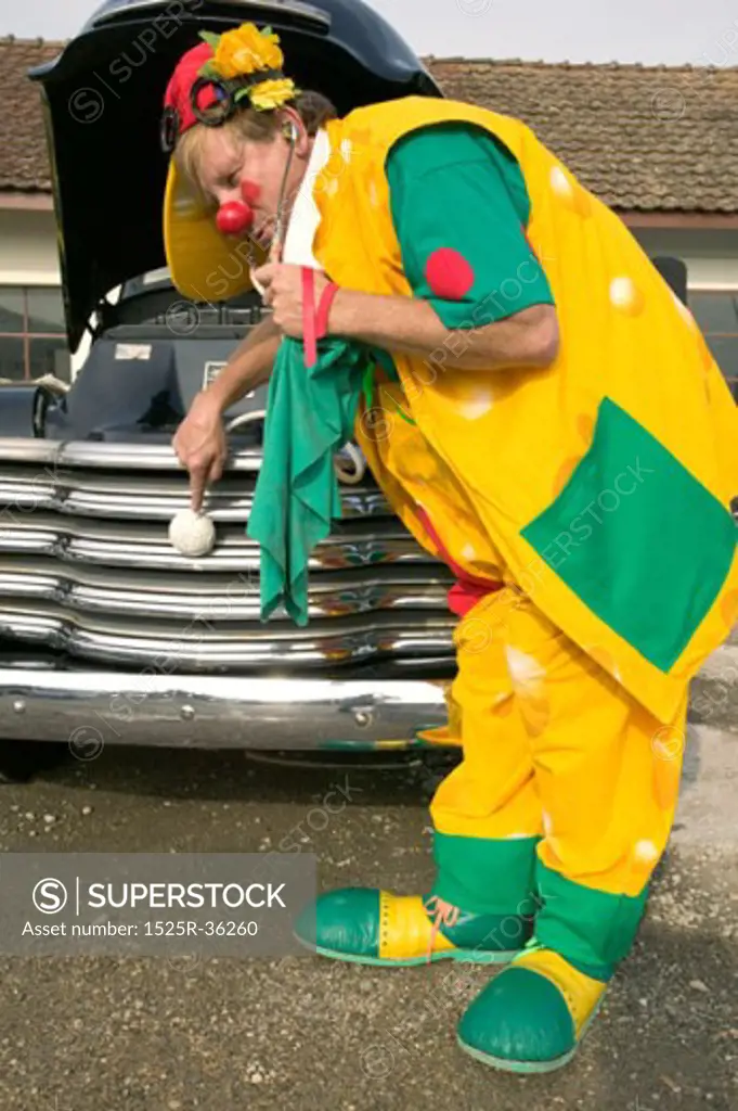 Clown Checking The Pulse Of His Clownmobile