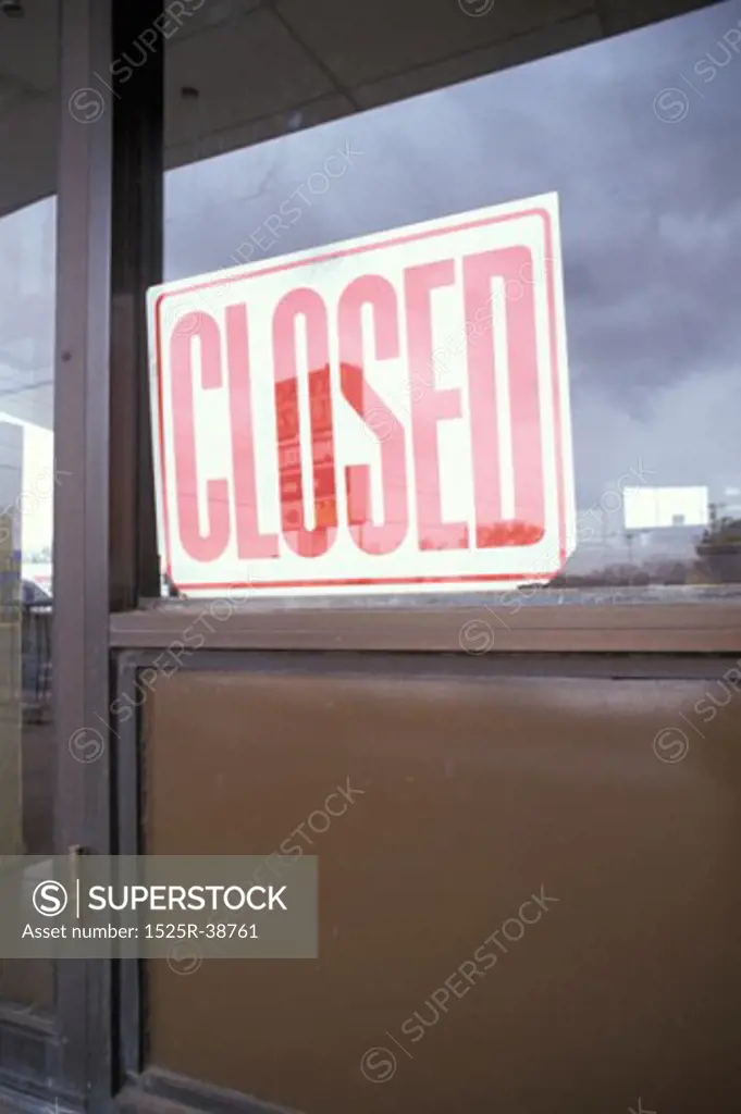 Vacant Department Store With Closed Sign In Window
