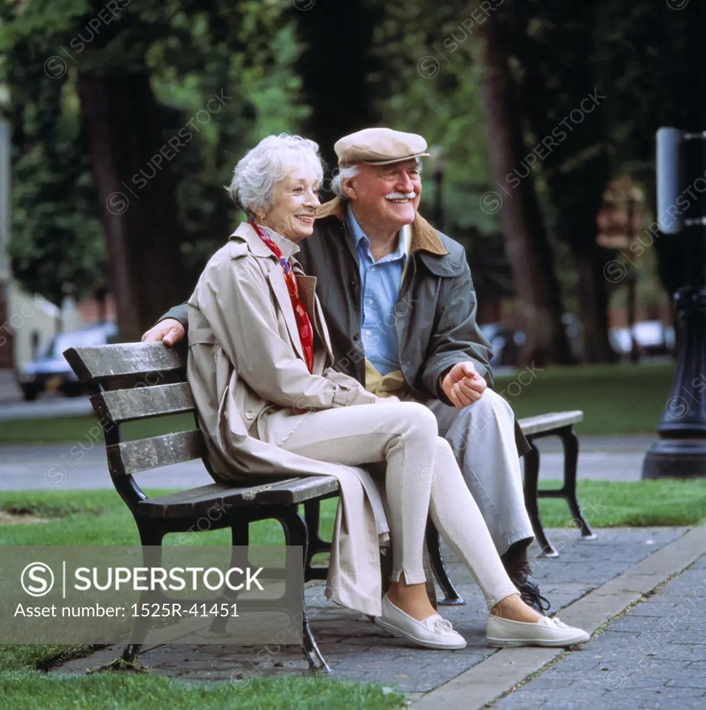 Old Couple Sitting on Park Bench Together