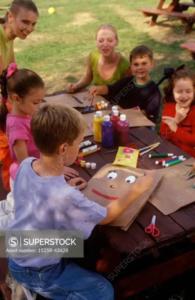 Daycare Students Having Arts and Crafts in a Park
