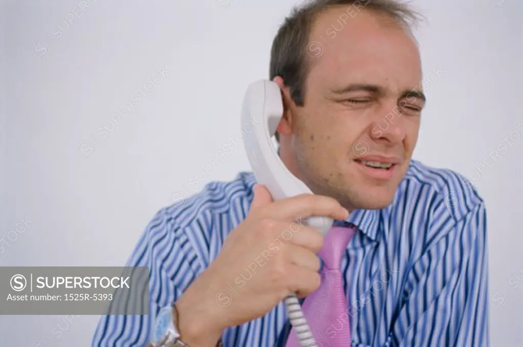 Close-up of a businessman talking on the phone