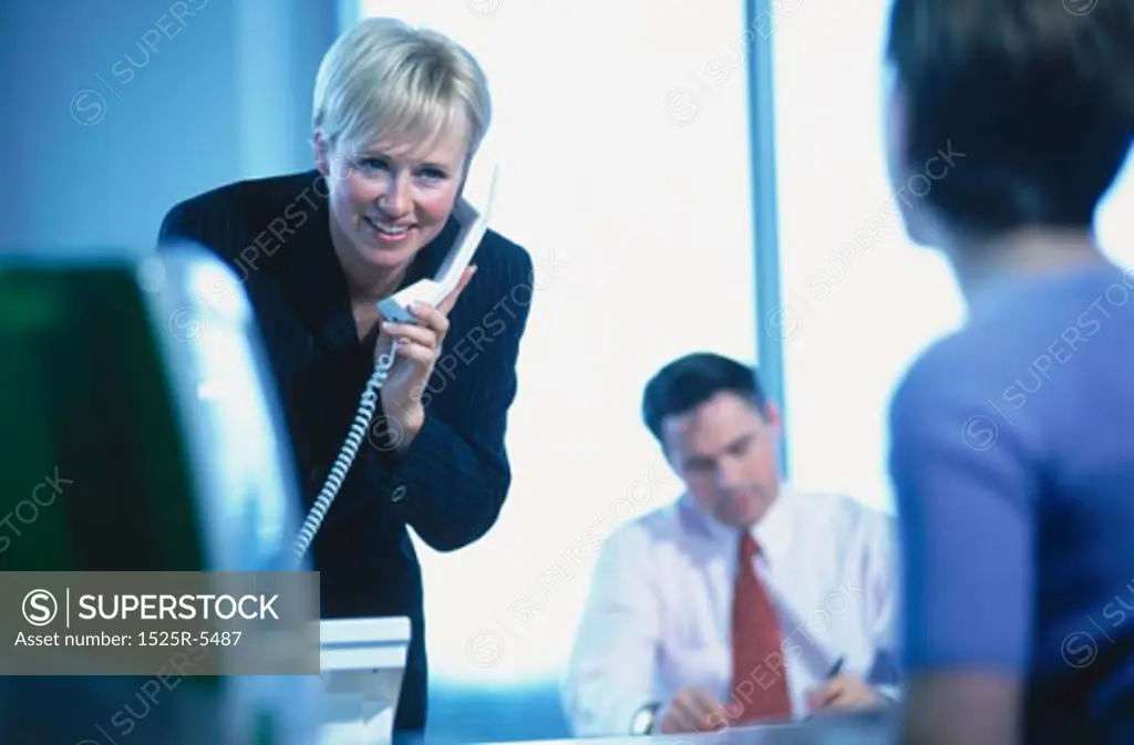 Businesswoman talking on the phone in an office