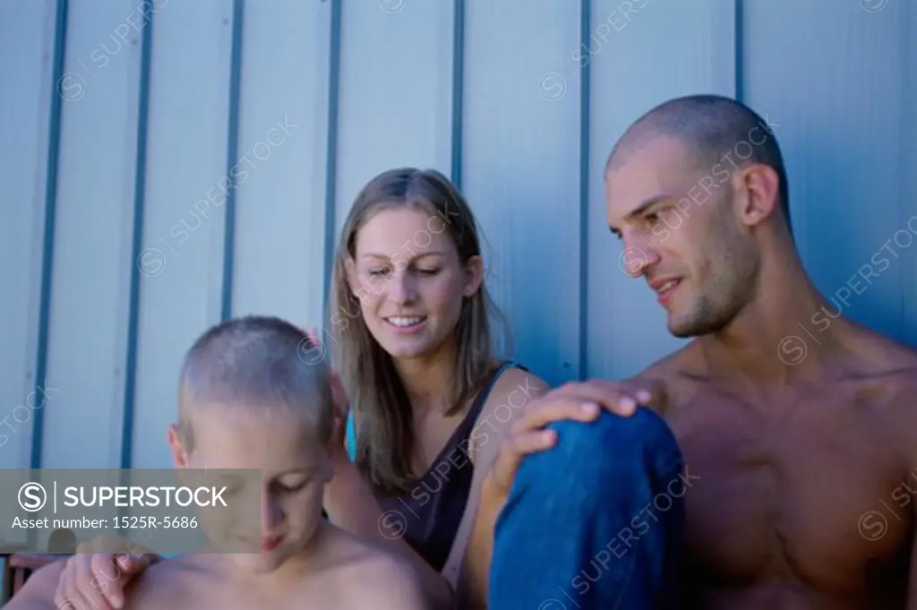 Parents sitting with their son