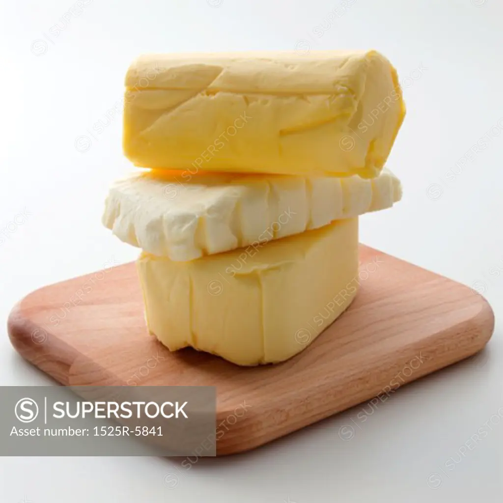 Close-up of a stack of cheese on a cutting board