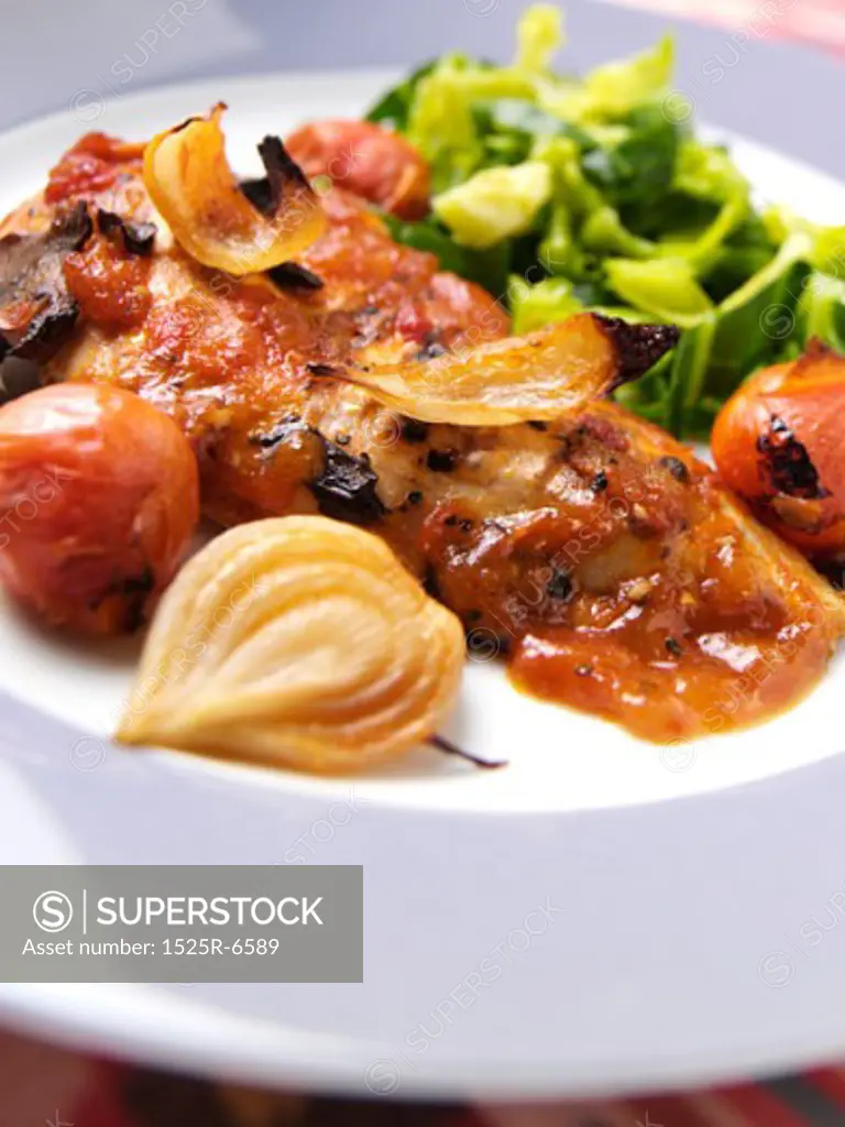 Close-up of cooked meat with vegetables on a plate