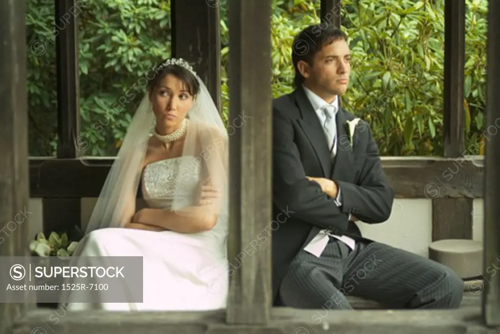 A newly married couple sitting in a gazebo