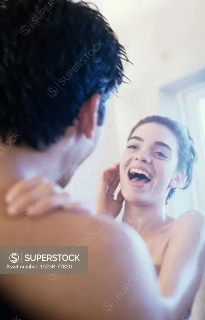 Young couple taking a shower together