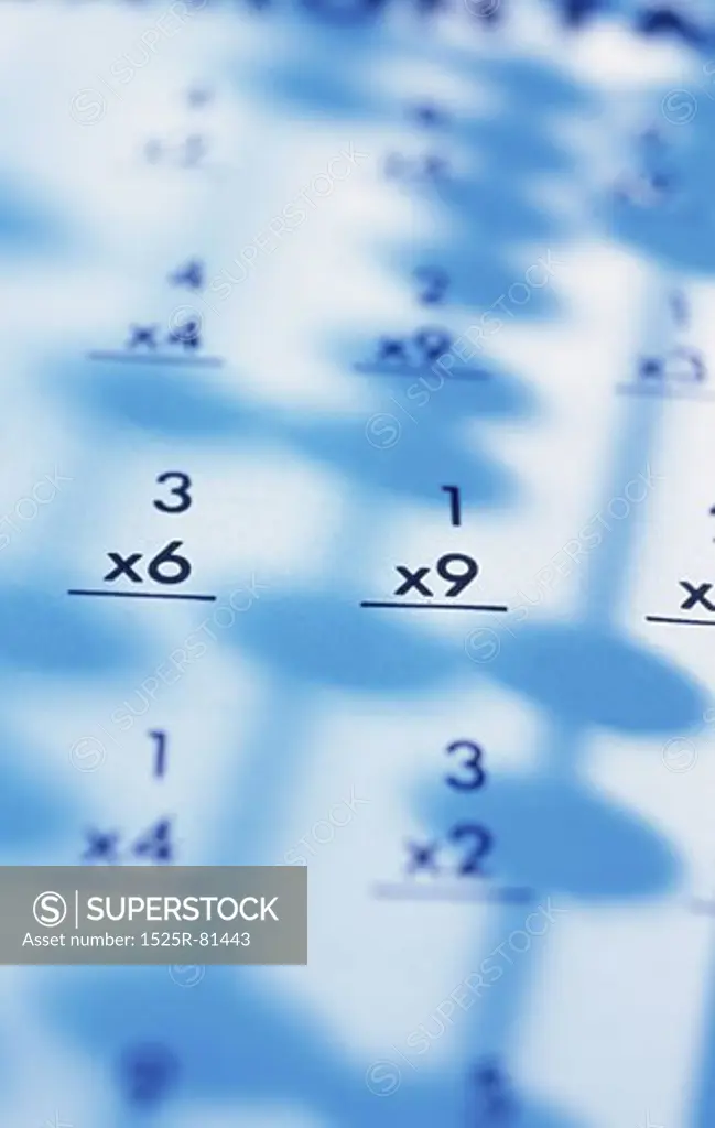 Shadow of an abacus on sheets of paper with calculations