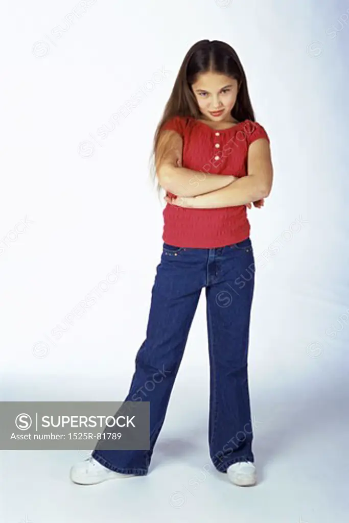 Portrait of a girl standing with her arms folded