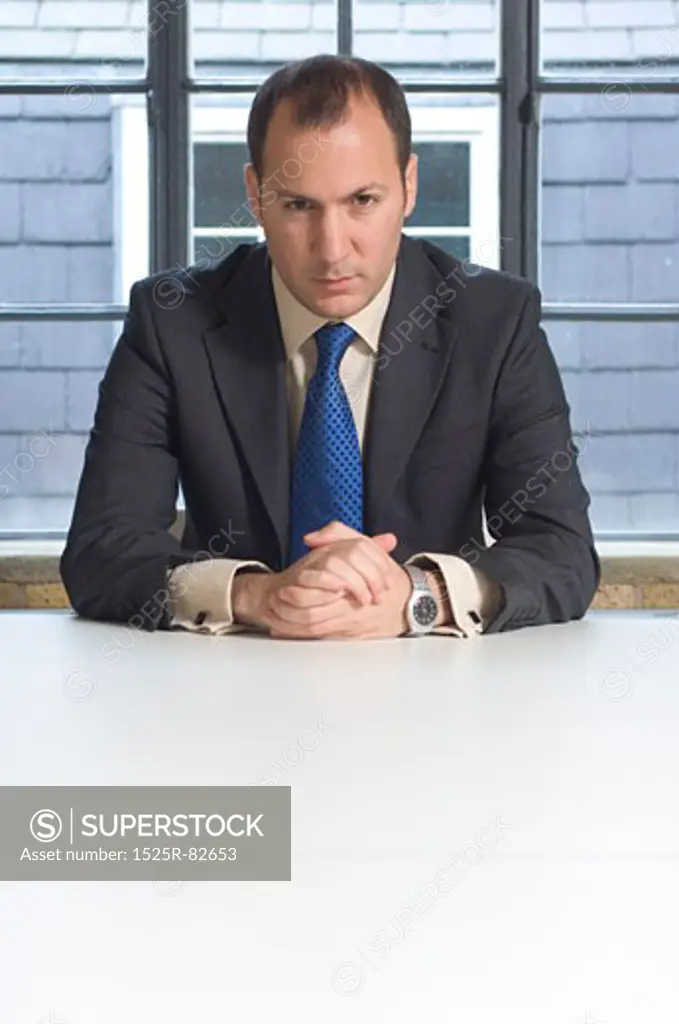 Businessman sitting at a table in an office