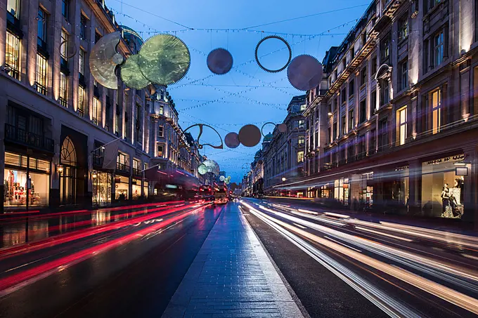 Christmas lights and traffic on Regent street at dusk, London, UK