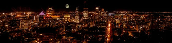 Montreal downtown buildings at night. Night city panorama skyline. View from Mount-Royal. Canada.