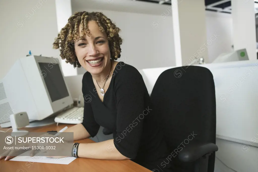 Portrait of a young, smiling businesswoman.
