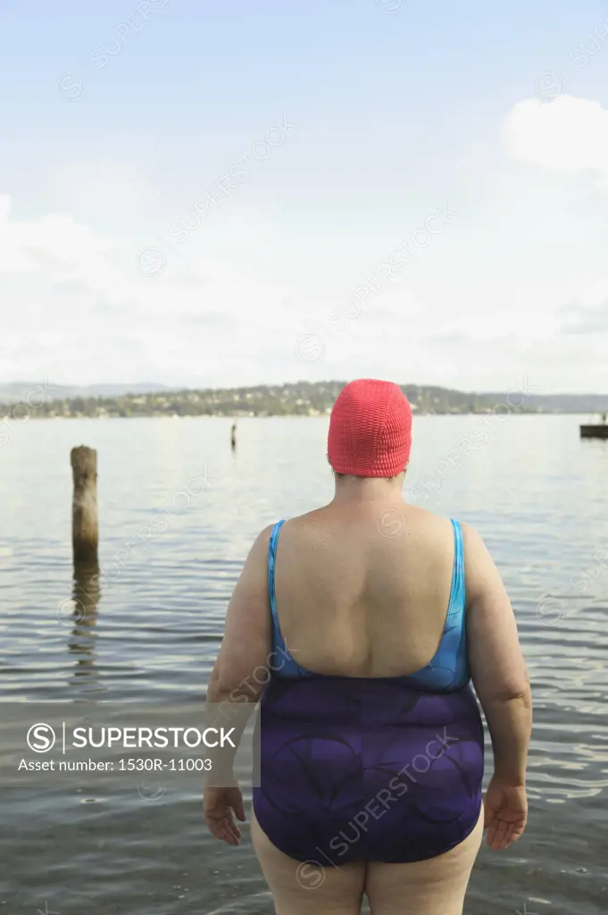 Rear view of a large woman in a bathing suit.