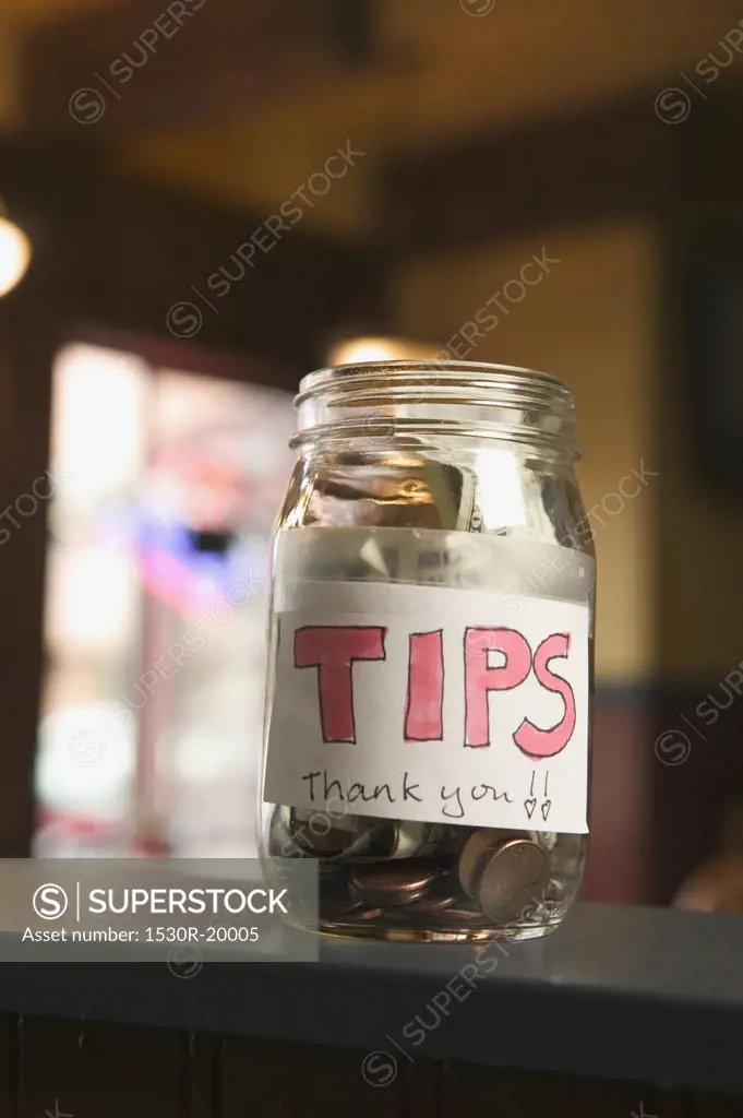 Still life of a full tip jar.