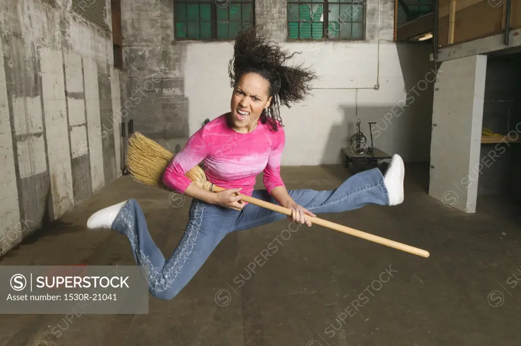Young woman playing the air guitar