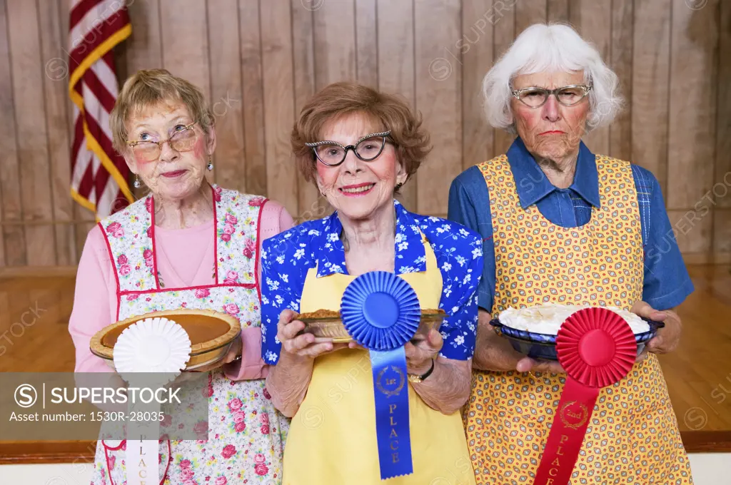 Three women with prizes for homemade pies