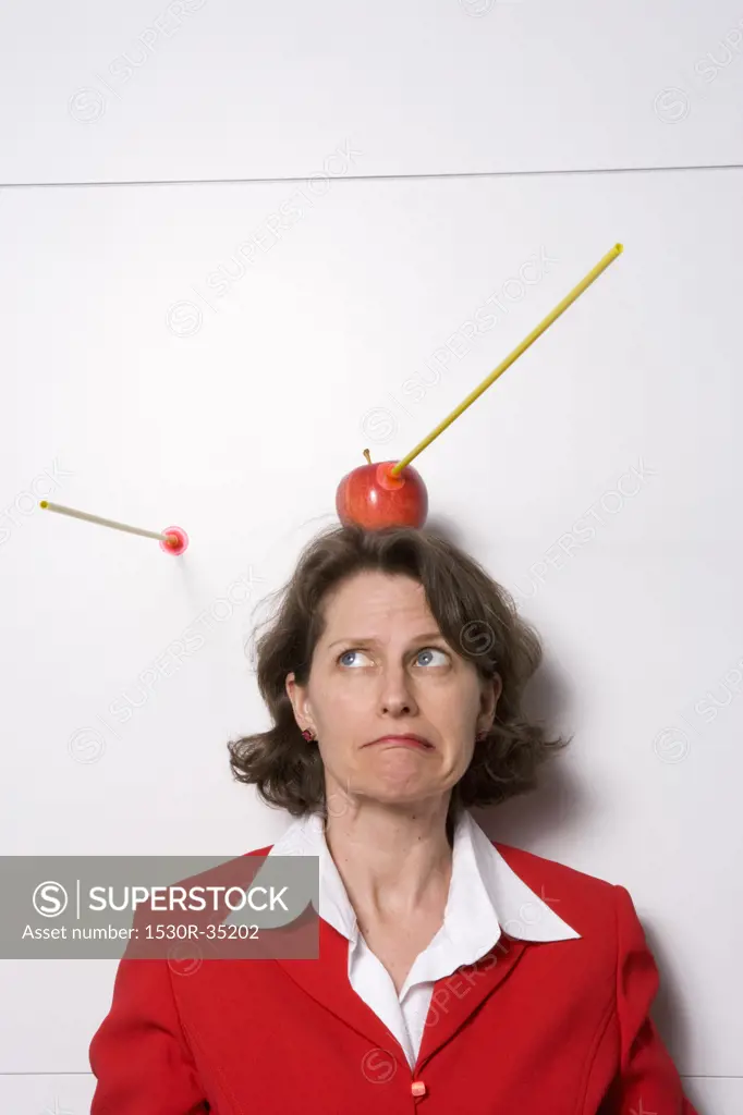 Shooting apple off businesswoman's head