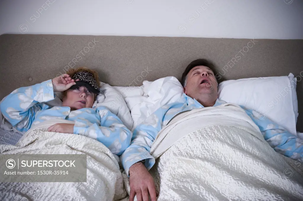 Woman awakened by snoring husband