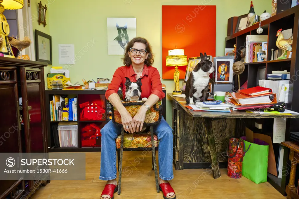 Woman at home office desk with dogs