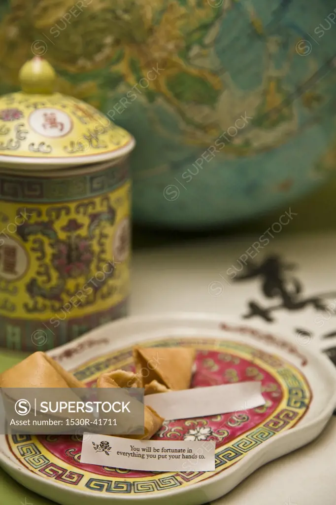 Still life with fortune cookies and globe,