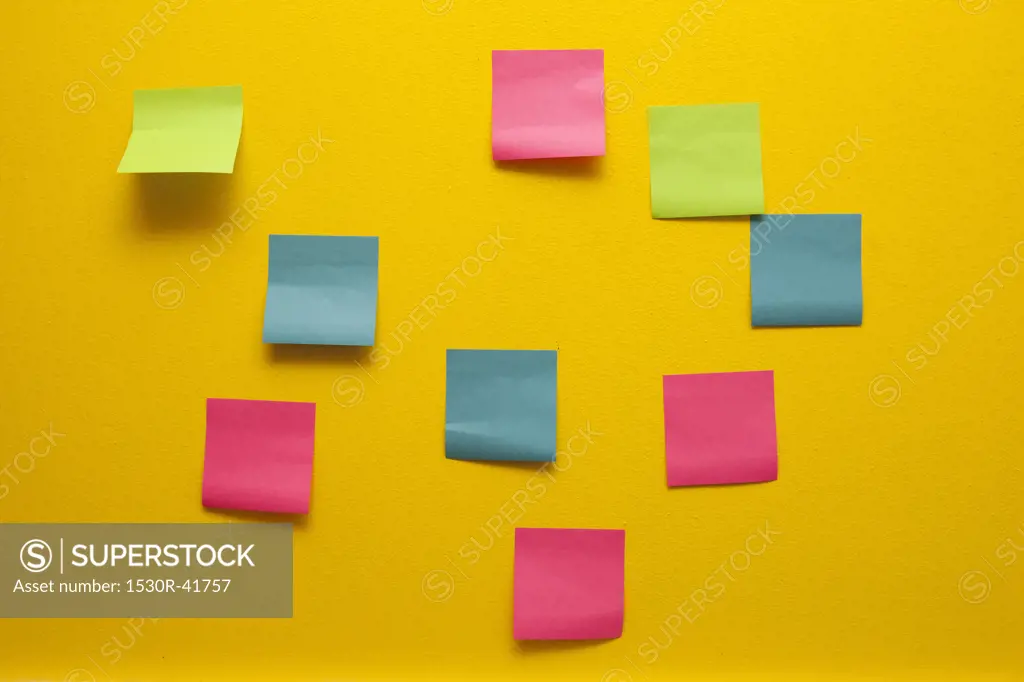 Yellow wall with colorful post-its,