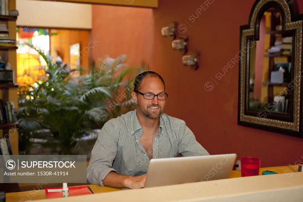 Man seated at desk in home office