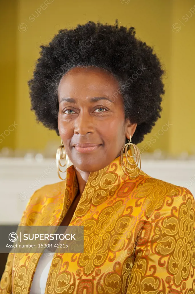 Portrait of elegant woman in gold jacket