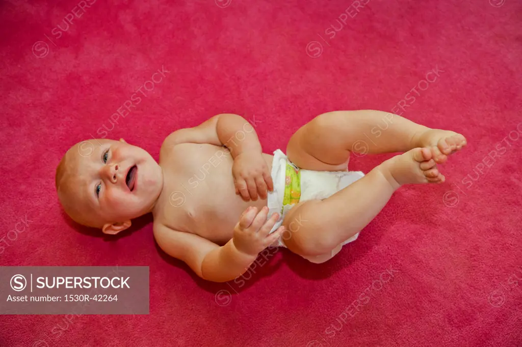 Baby on red background