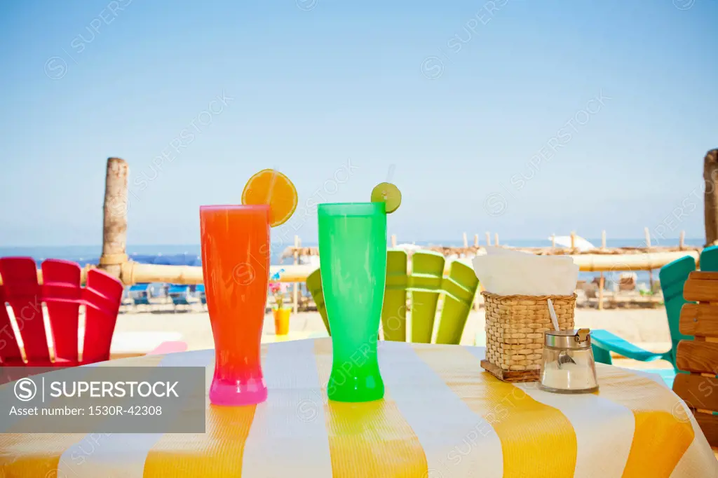 Colorful drinks on seaside table