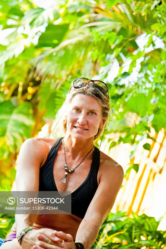 Portrait of woman in tropical location