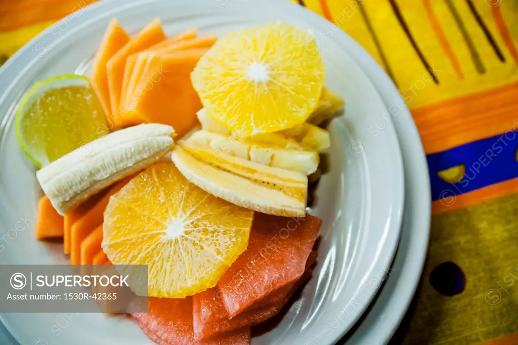 Place setting with plate of fruit
