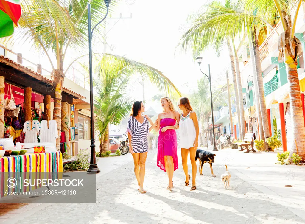 Three women shopping in seaside town