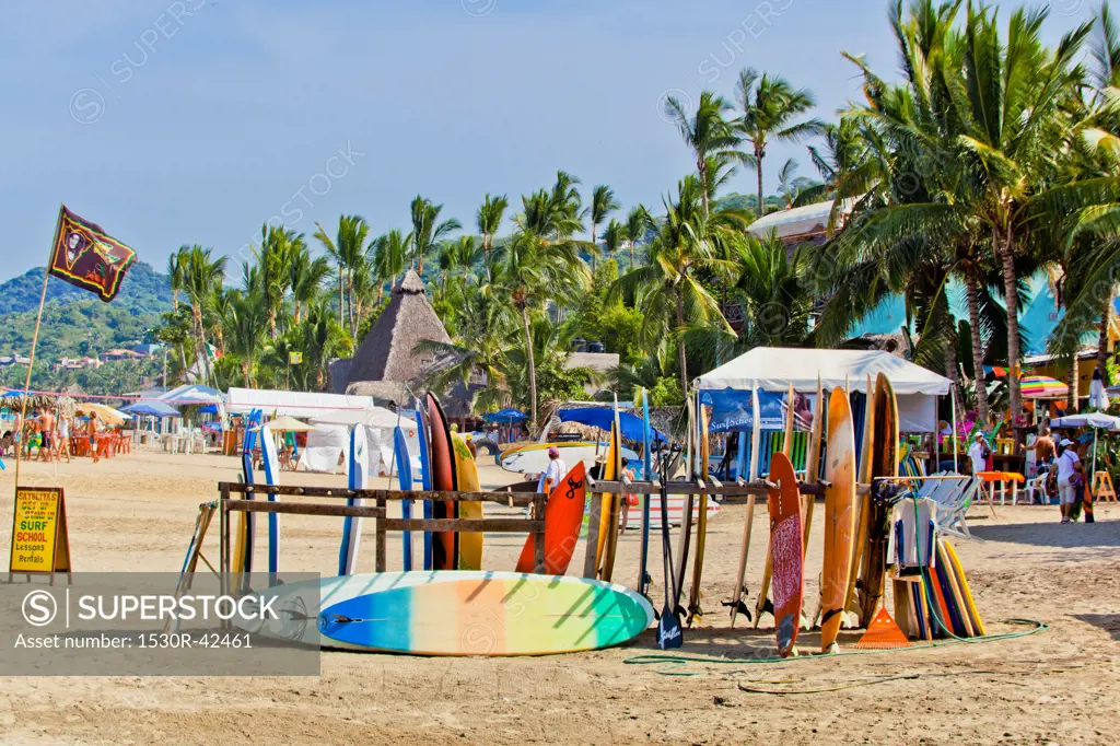Racks of surfboards on beach at sayulita