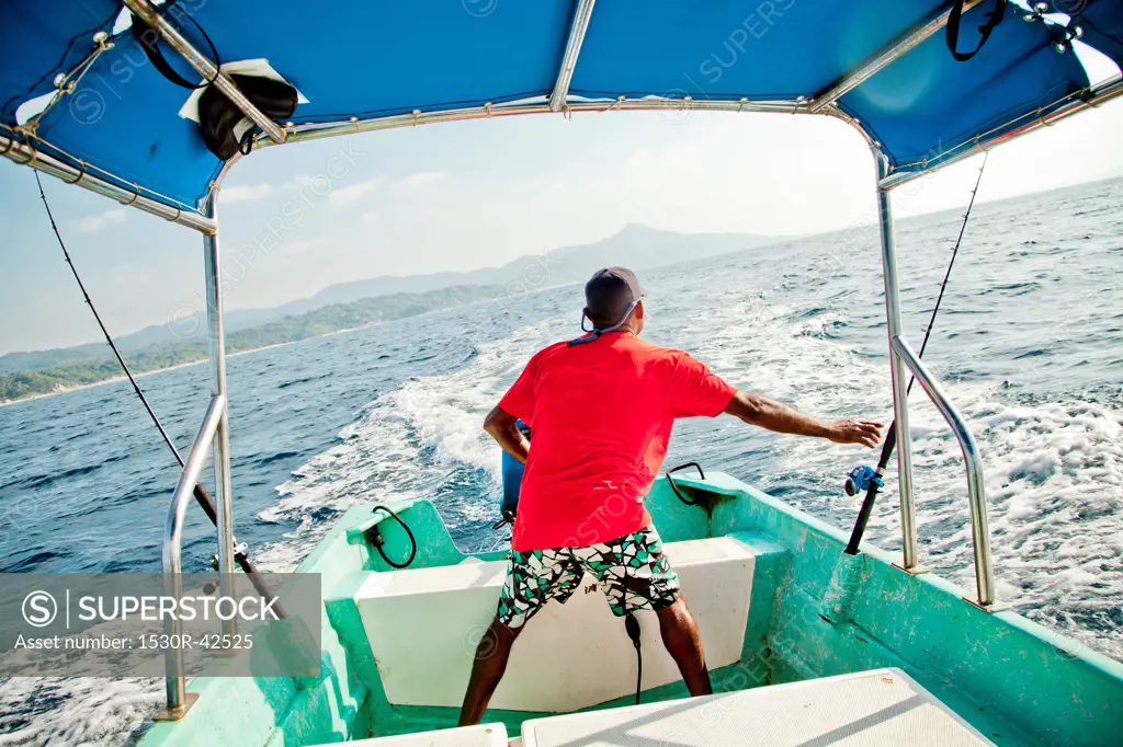 Man running fishing charter boat