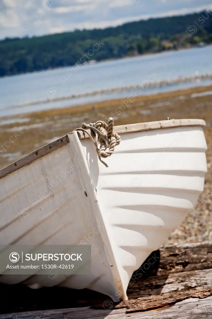 Wooden rowboat on beach